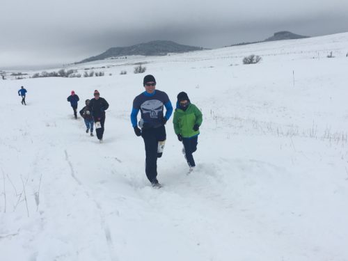 dr. kenney and son running in snow