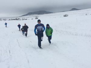 dr. kenney and son running in snow